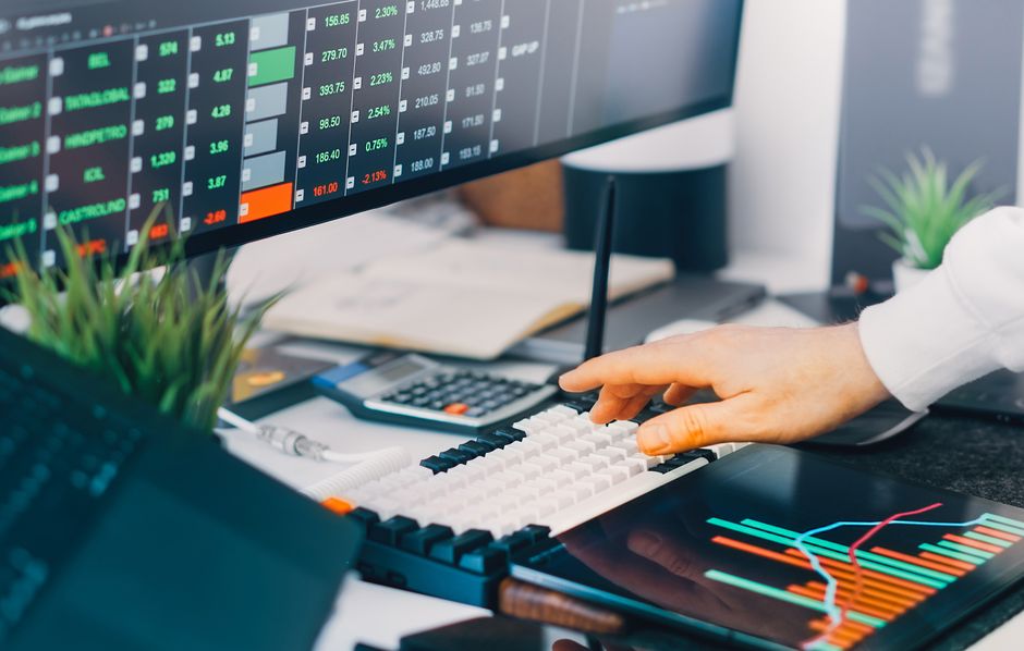 ga4 custom dimension — Professional workspace with trading charts and market data on screens, ideal for finance and inve