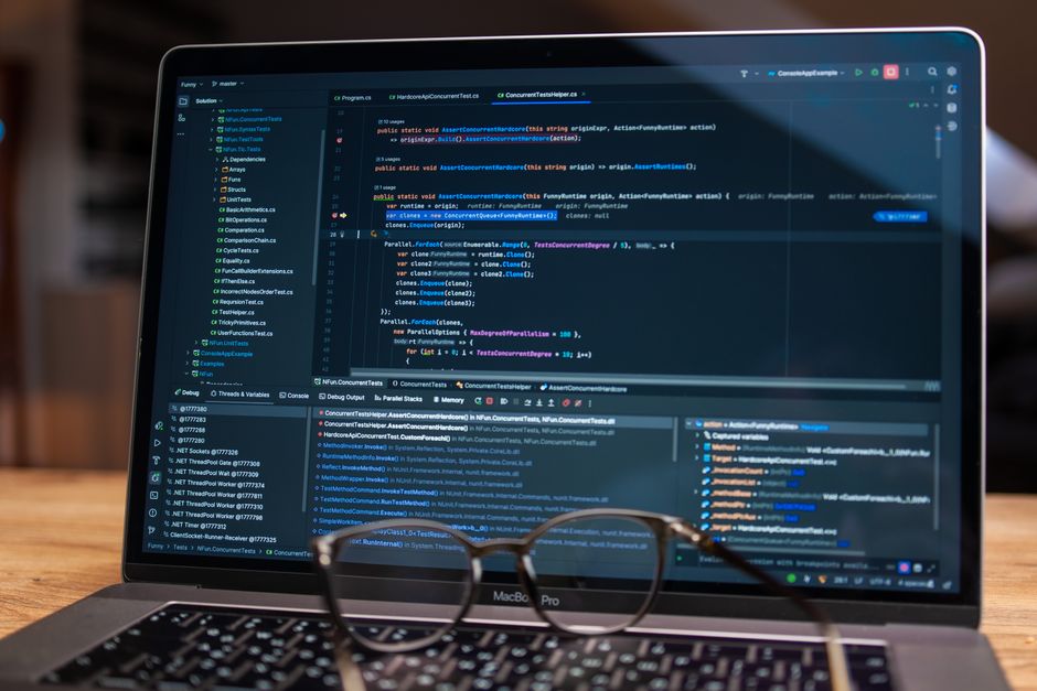 schema markup — Laptop screen showing debugging software with code, perfect for tech and software development themes.